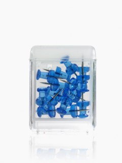 Studio shot of blue thumbtacks in glass cube. Photo : David Arky