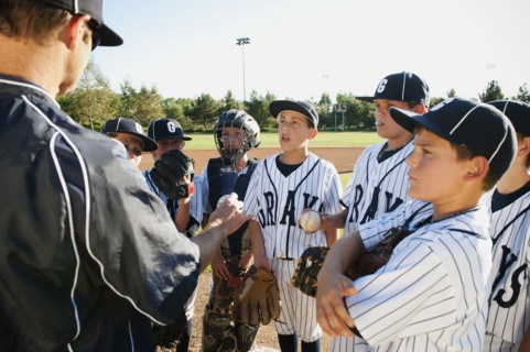 USA, California, Ladera Ranch, coach training little league baseball team (10-11).