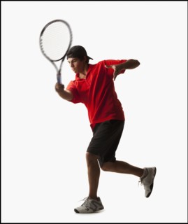 Young man playing tennis. Photo : Mike Kemp