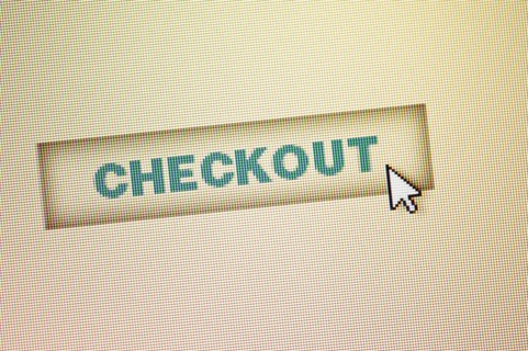 Curser by checkout icon on computer screen.