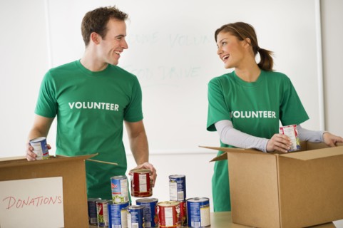 USA, New Jersey, Jersey City, Two young people as volunteers.