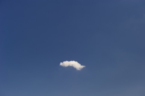 Single cloud in blue sky.