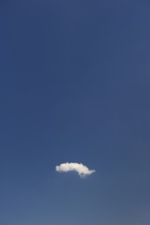 Single cloud in blue sky.