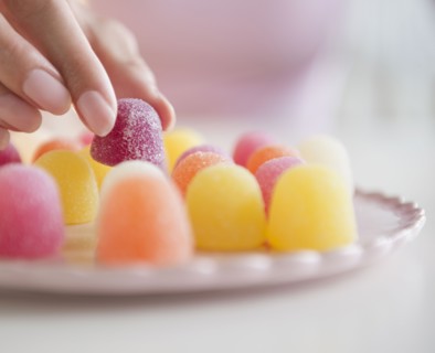 USA, New Jersey, Jersey City, Woman's hand eating jellies. Photo : Jamie Grill Photography