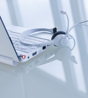 USA, New Jersey, Jersey City, Close-up view of open laptop and headset . Photo : Daniel Grill