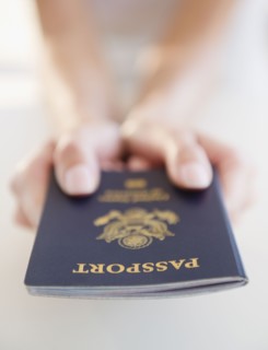 USA, New Jersey, Jersey City, Close-up view of woman's hands holding US passport. Photo : Jamie