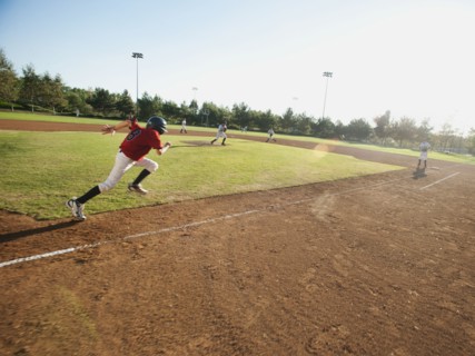 USA, California, little league baseball team (10-11) during baseball match.