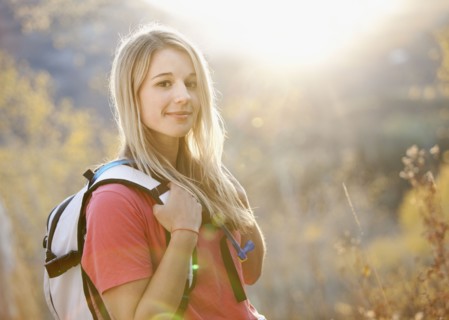 USA, Utah, portrait of young woman hiking in forest. Photo : Mike Kemp