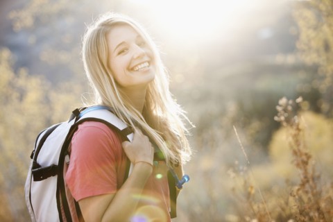 USA, Utah, portrait of young woman hiking in forest. Photo : Mike Kemp