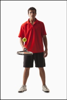 Young man playing tennis. Photo : Mike Kemp