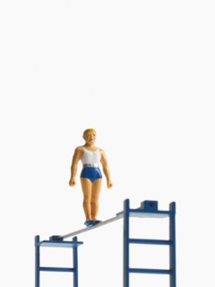 Studio shot of figurines on ladders. Photo : David Arky