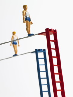 Studio shot of figurines on ladders. Photo : David Arky