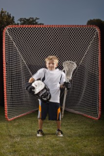 USA, Utah, Provo, Portrait of junior (6-7) lacrosse player in goal. Photo : FBP