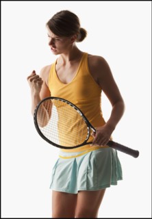 Young woman playing tennis winning. Photo : Mike Kemp