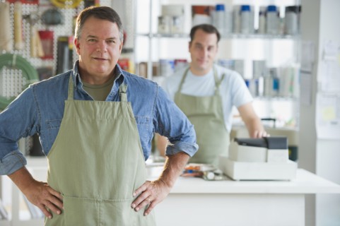USA, New Jersey, Jersey City, Portrait of hardware shop owner and assistant.