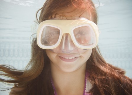 USA, New York, Girl (10-11 in swimming pool. Photo : Jamie Grill Photography