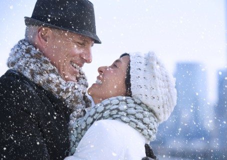 Happy mature couple in winter scenery.
