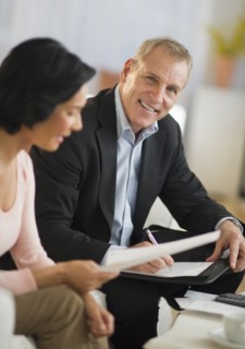 Woman talking to financial advisor.
