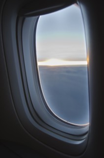 Clouds seen through airplane window.