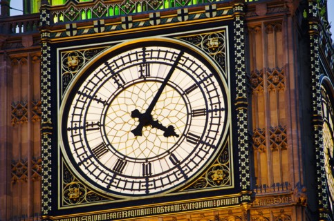 United Kingdom, London, Big Ben clock face illuminated at dusk.