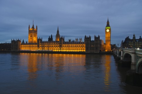 United Kingdom, London, Houses of Parliament illuminated at dusk.