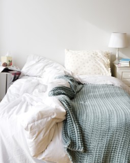Messy bed in bedroom. Photo : Jamie Grill Photography