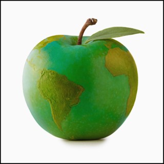 Apple in shape of globe, studio shot. Photo : Mike Kemp
