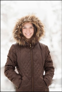 USA, Utah, Lehi, Portrait of young woman wearing winter coat outdoors. Photo : Mike Kemp
