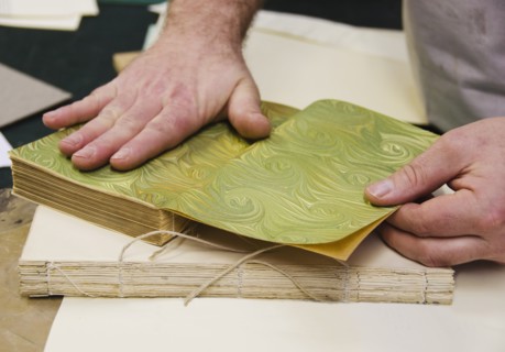 Hands binding book.