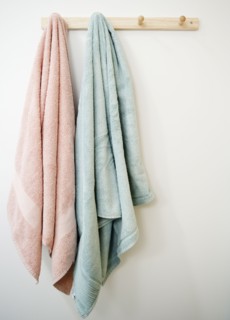 Towels hanging on rack. Photo : Jamie Grill Photography