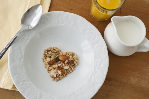 Heart shaped breakfast cereal in bowl.