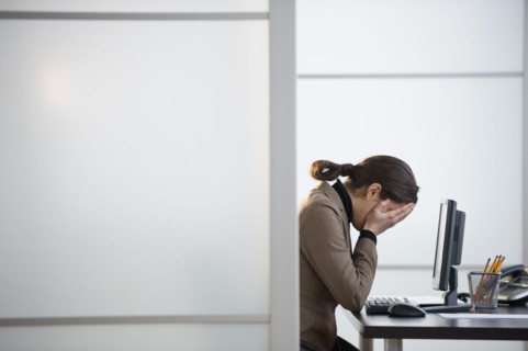 Portrait of young woman in office.