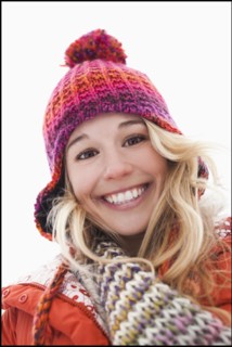 Portrait of young woman wearing winter clothes outdoors. Photo : Mike Kemp