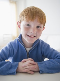 Portrait of smiling boy (8-9) . Photo : Jamie Grill Photography
