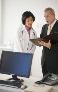 Female doctor s with hospital executive.