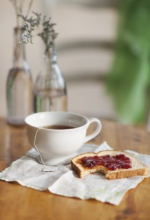 Cup of tea and toast with marmalade.