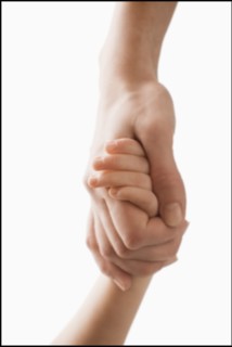 Studio shot of hands of woman and girl (2-3). Photo : Mike Kemp