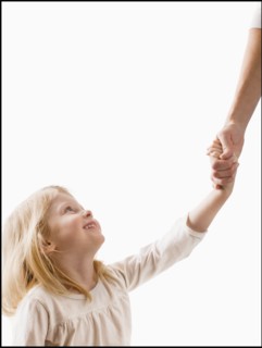 Studio shot of girl (2-3) holding adult's hand. Photo : Mike Kemp