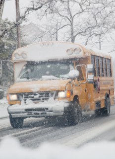USA, New Jersey, Jersey City, school bus on road during blizzard. Photo : Jamie Grill Photography
