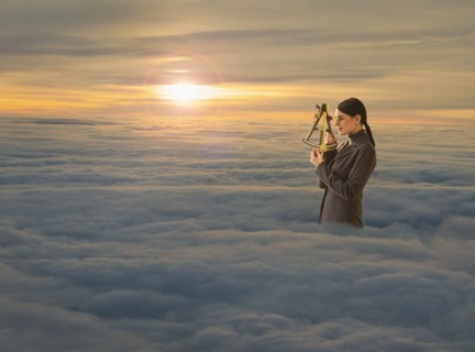 Women above clouds looking through sextant.