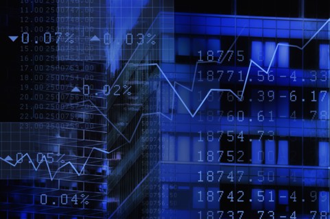 USA, New York, New York City, stock quotes reflecting on window.