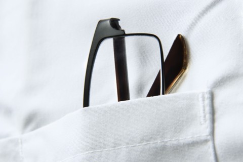 Glasses in pocket of doctors coat. Photo : Joe Clark