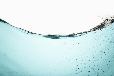 Water with bubbles on white background. Photo : Joe Clark