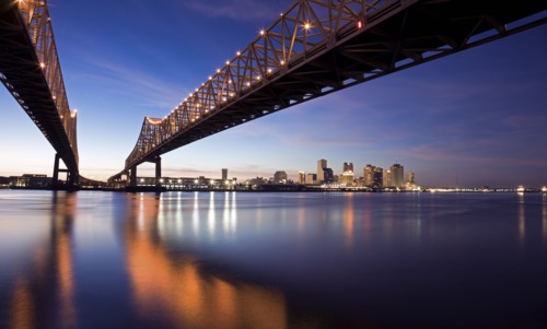 USA, Louisiana, New Orleans, Toll bridge over Mississippi River at sunset. Photo : Henryk Sadura