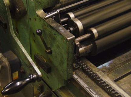 Close up of antique printing roller.