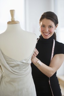 Portrait of young fashion designer at work.