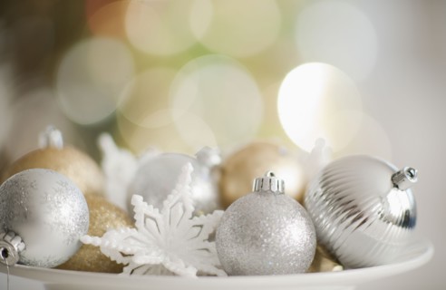 Christmas baubles on plate.