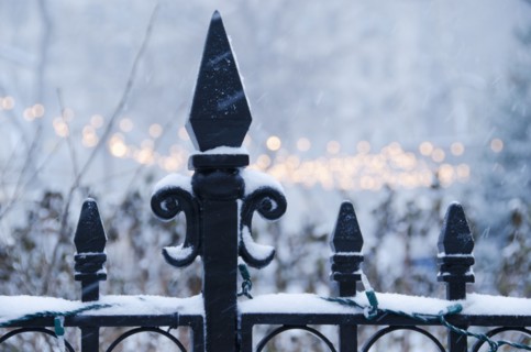 USA, New York State, New York City, antique fence covered with snow.
