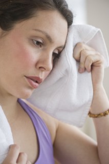 Tired young woman at fitness.