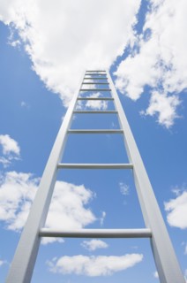 Ladder reaching cloudy sky. Photo : Chris Hackett